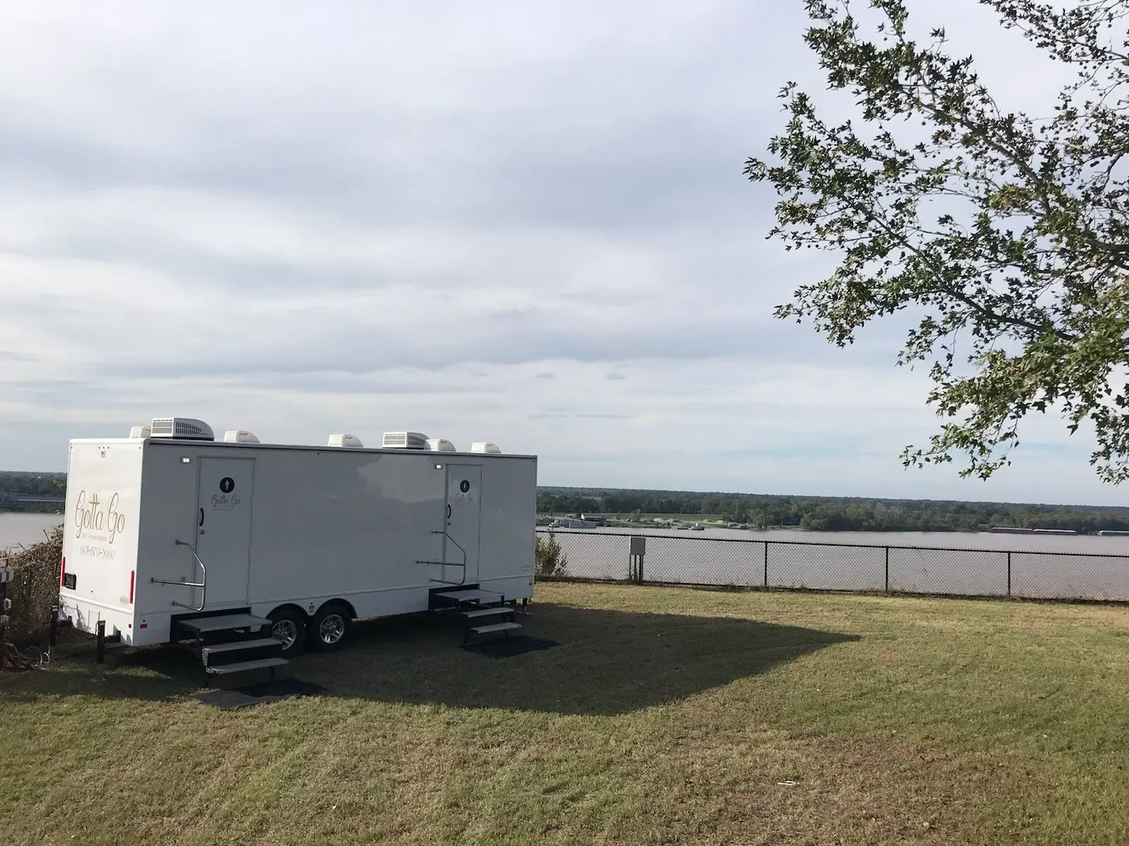 Restroom trailer parked in a field