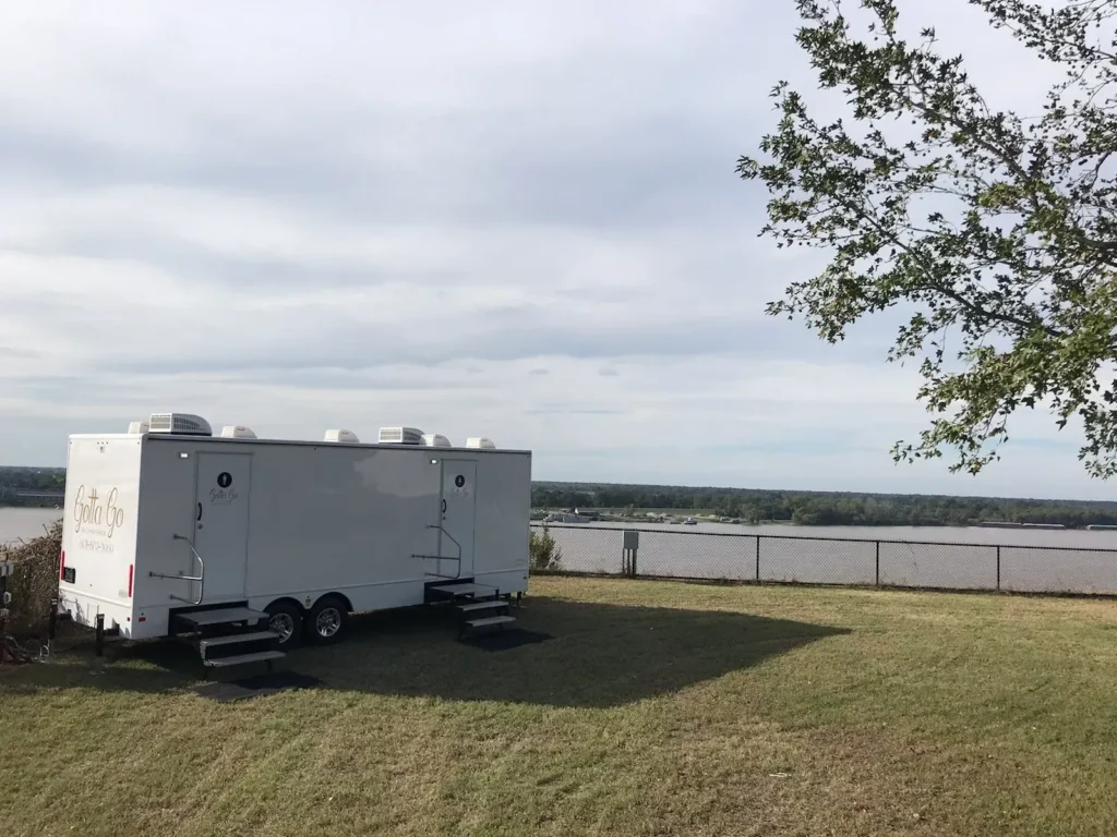 Restroom trailer parked in a field