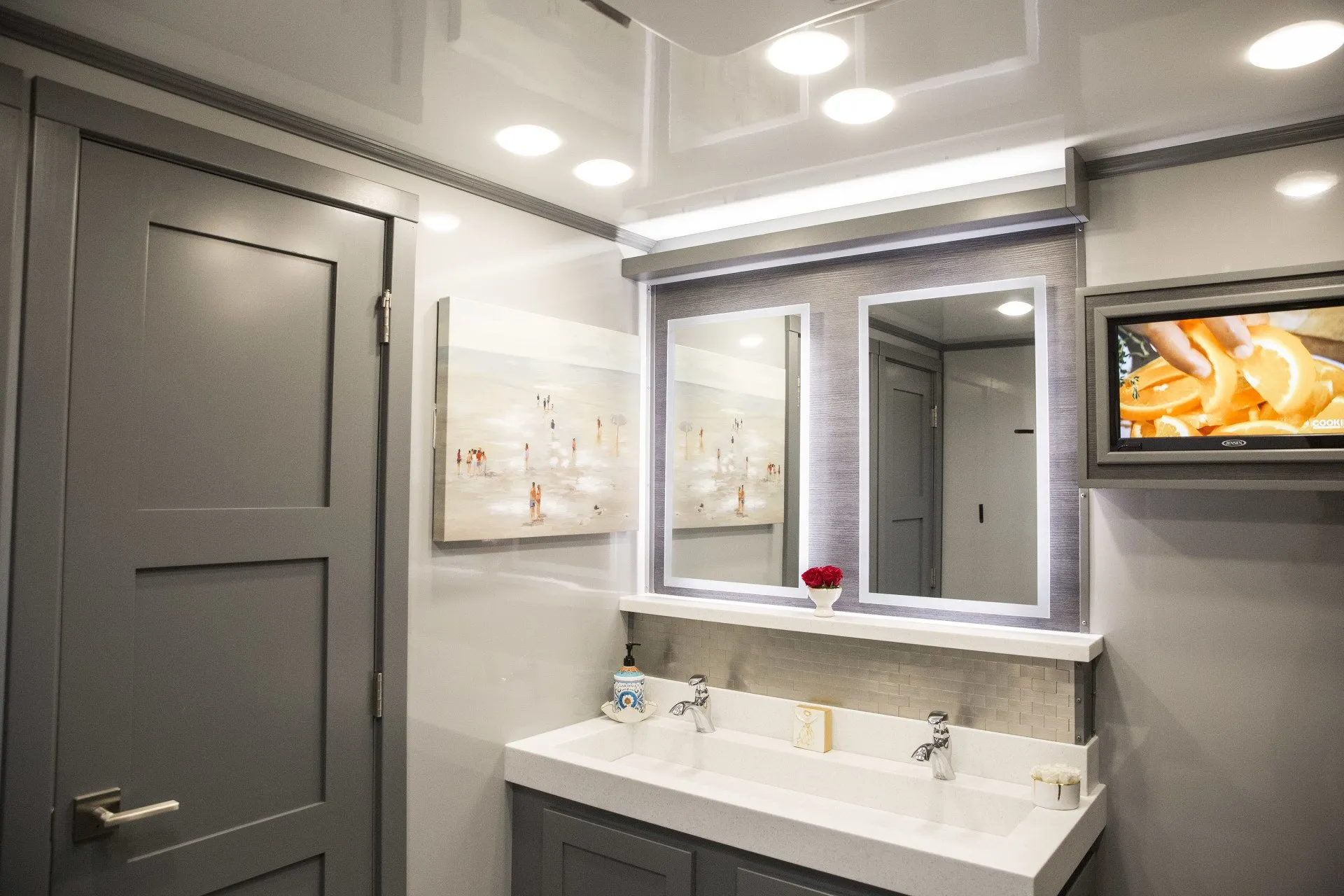 An interior of the ultra luxury class restroom trailer with mirror and vanity